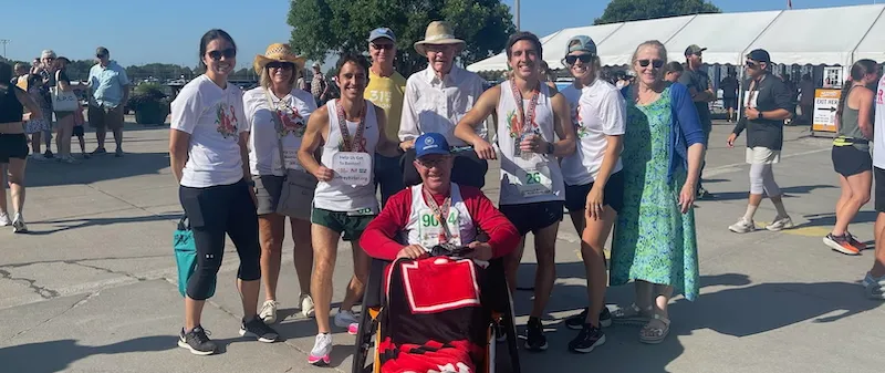 the Birkel family gathered around Jeff after qualifying for the Boston Marathon